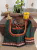 In rich green and deep garnet