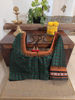 In rich green and deep garnet