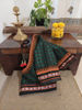 In rich green and deep garnet